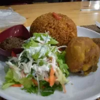 Snapdishの料理写真:jollof rice with Kentucky fried chicken and coleslaw|Isaac Eastwoodさん