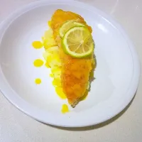 hake fish on a bed of mash and some lemon sauce.|call me the thick chefさん