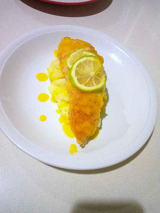 hake fish on a bed of mash and some lemon sauce.|call me the thick chefさん