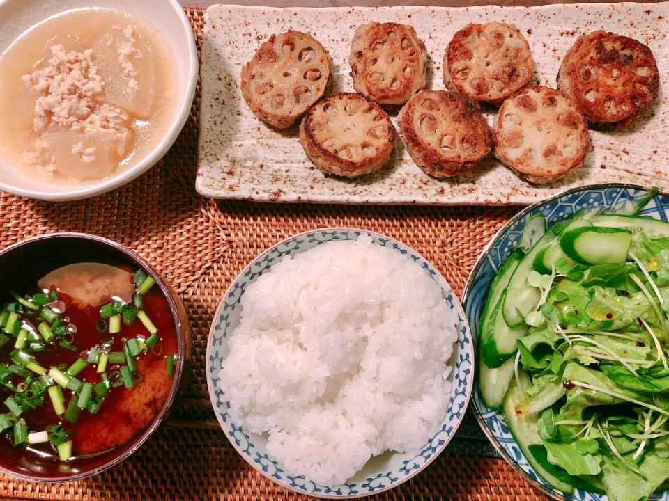 Stir fried slices of lotus root with a filling minced meat, salad, simmered winter melon and minced meat, miso soup|taka-chanさん