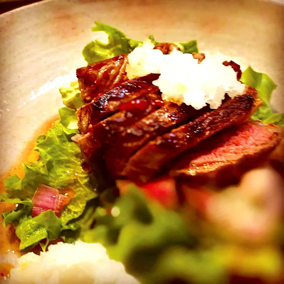 Snapdishの料理写真:Pan seared Striploin  heavily season in Sea Salt & pepper laid on salad marinated onions & leeks with Daikon served with and Garlic Red pepper Soy Sauce 
salad |Emanuel Hayashiさん