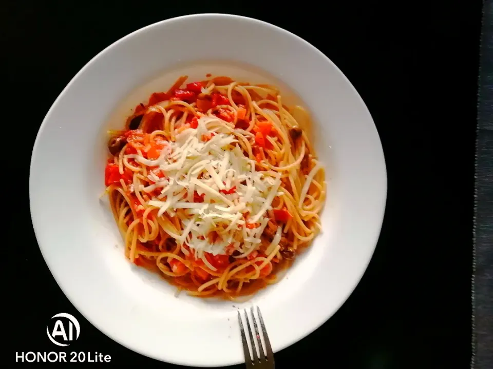 Spaghetti with  black olive, tomato "ciliegino", and salted ricotta... Italian food style|Ivan4760さん