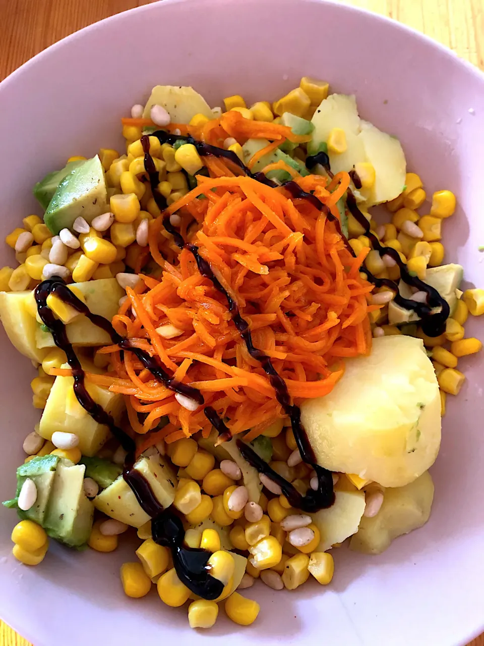 Potato salad with corn, avocado, pine nuts, marinated carrot and a drizzle of balsamic glaze|MissYumYumさん