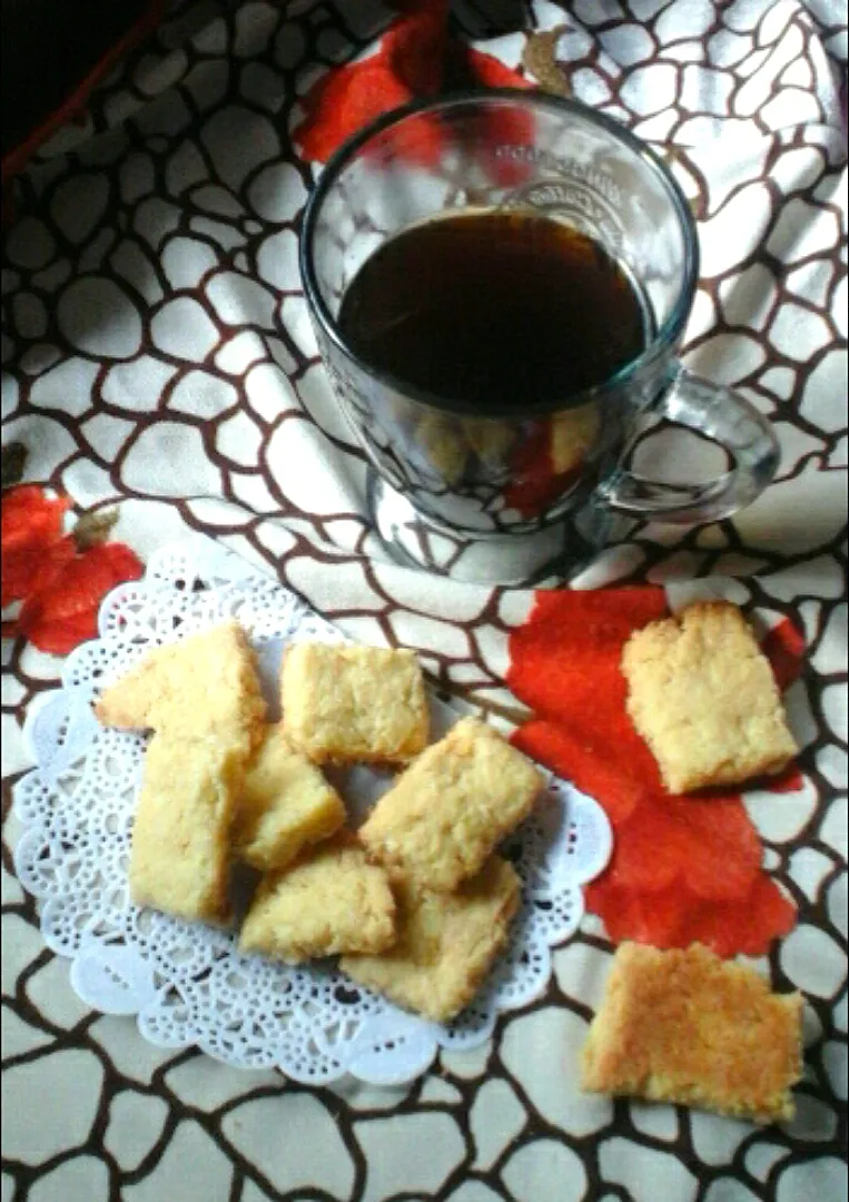 Coconut cookies with a glass of coffee|Ar's Kitchenさん