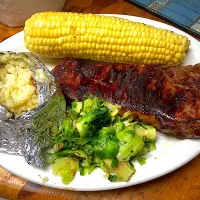 Snapdishの料理写真:Grilled NY Strip, Baked Potato, Corn & Brussel Sprouts|Michaels Culinary Adventuresさん