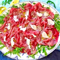 Snapdishの料理写真:Carpaccio di manzo, con Rucola e scaglie di Grana|kenさん