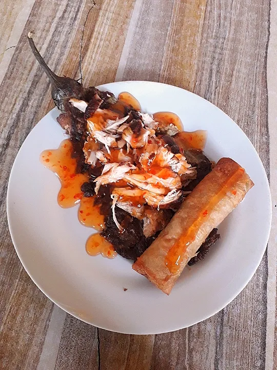 Fried eggplant topped with chicken strips and sweet & sour sauce, side with spring roll.|lorence_galeさん