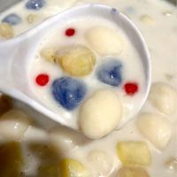 Ginataang bilo-bilo / ube & white rice balls simmered in coconut milk and sugar with sago , saba banana & sweet potato