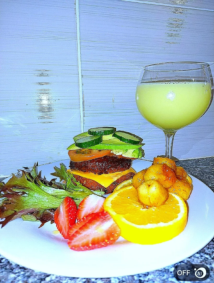 Snapdishの料理写真:Dinner and dessert on a plate.
Mash Potato cheese burger. Fried cinnamon-banana on fresh oranges|Tebzaさん