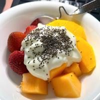 Fruit bowl yogurt chia seeds - strawberries, melon, mangoes