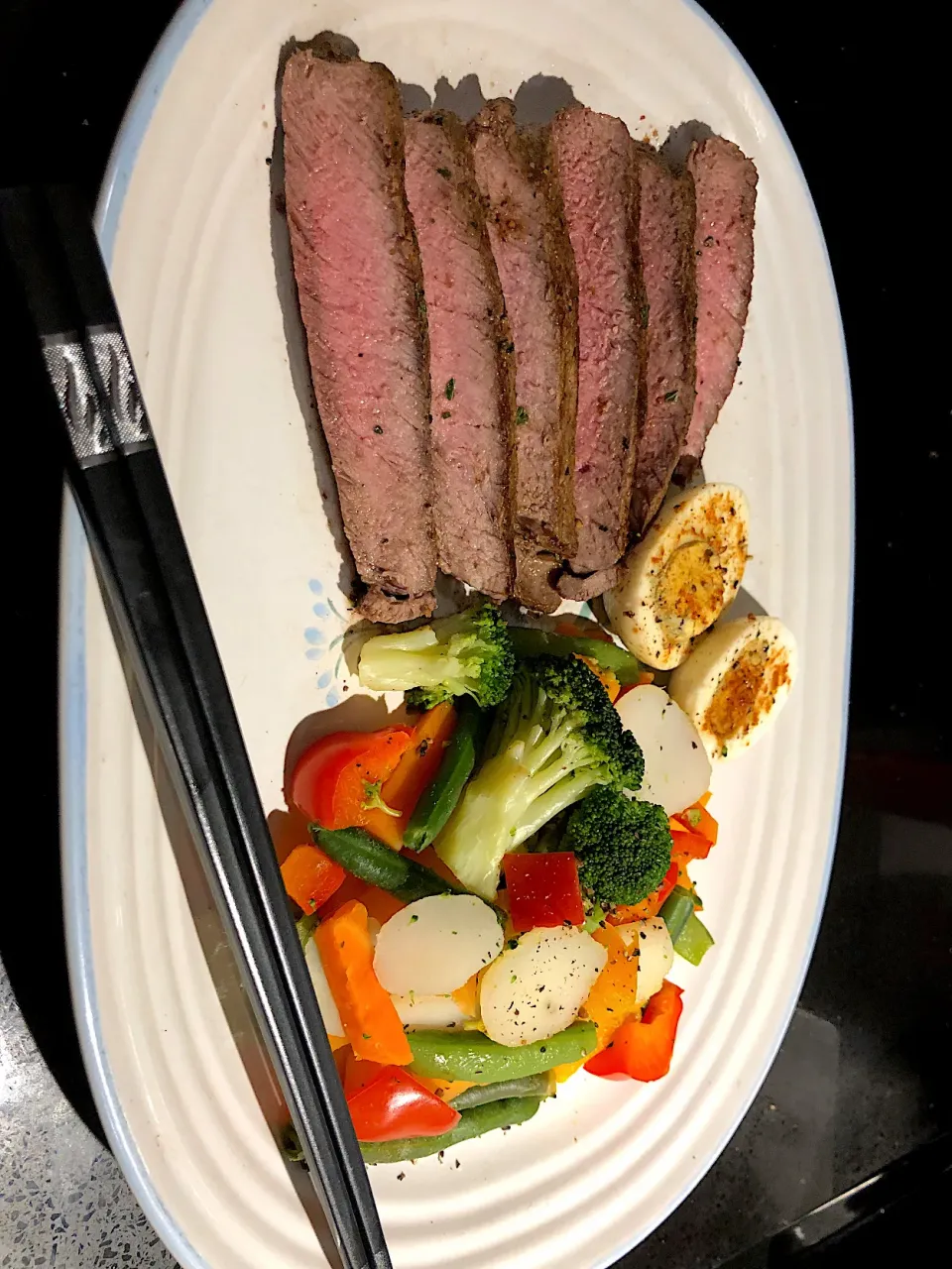 BentoFox's dish Keg Montreal steak seasoned steak, with a side of mixed vegetables and a pickled egg topped with paprika|BentoFoxさん