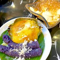 Sweet soybean pudding with boba pearls topped with brn sugar caramel syrup, bibingka rice cakes and purple rice cake puto bumbong cooked / steamed in bamboo tubes
