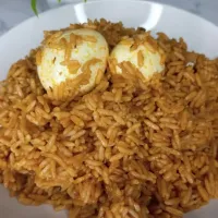 jollof rice and boiled eggs.|ebyzrecipes1さん