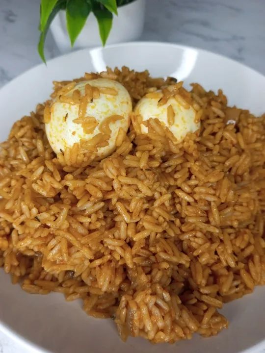 jollof rice and boiled eggs.|ebyzrecipes1さん