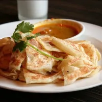 Snapdishの料理写真:Malaysian ‘roti canai’ as been ranked the best street food in the world - based travel guide TasteAtlas.

It has an outer texture of a flaky pastry but is soft |FM230466$afさん