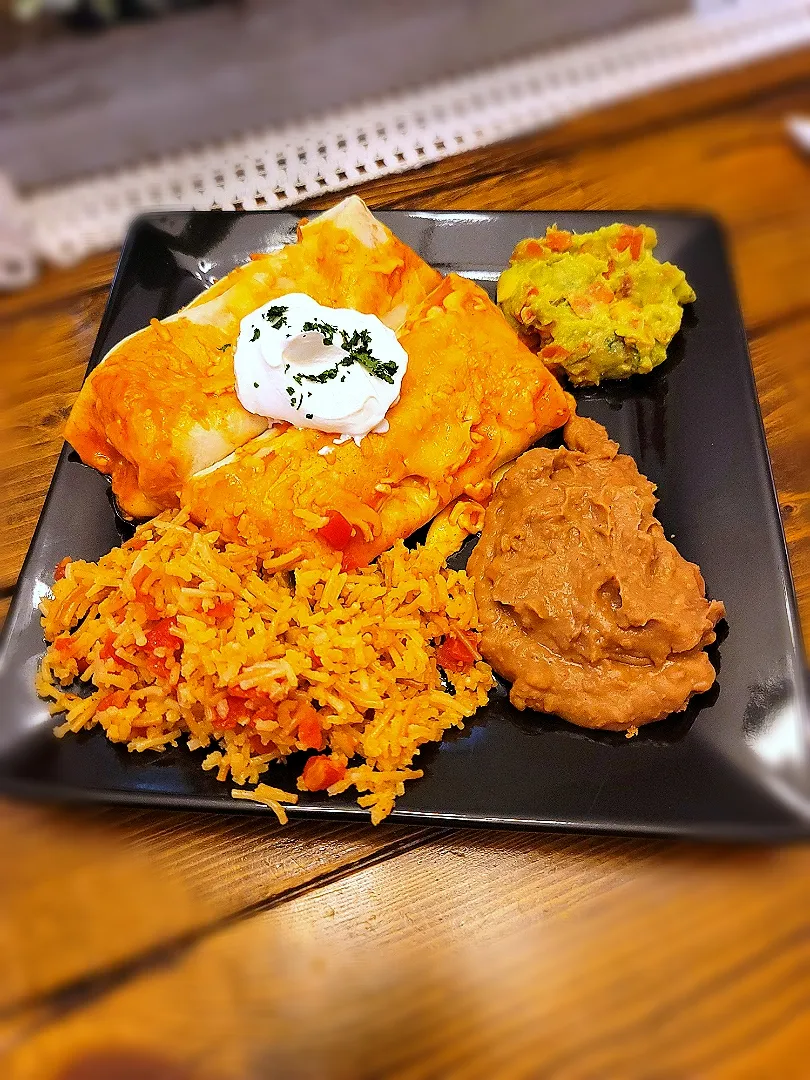 Snapdishの料理写真:Beef enchiladas with Spanish rice and refried beans|Travis Stoneさん