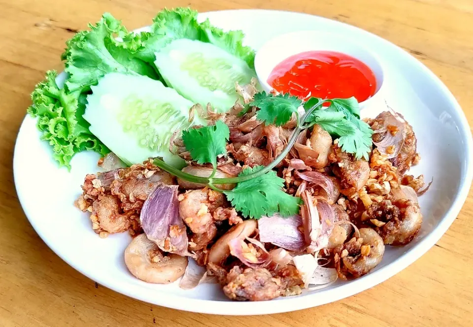 Snapdishの料理写真:Deep fried pork intestines topped with crispy garlic & pepper|Paul Chirayusさん