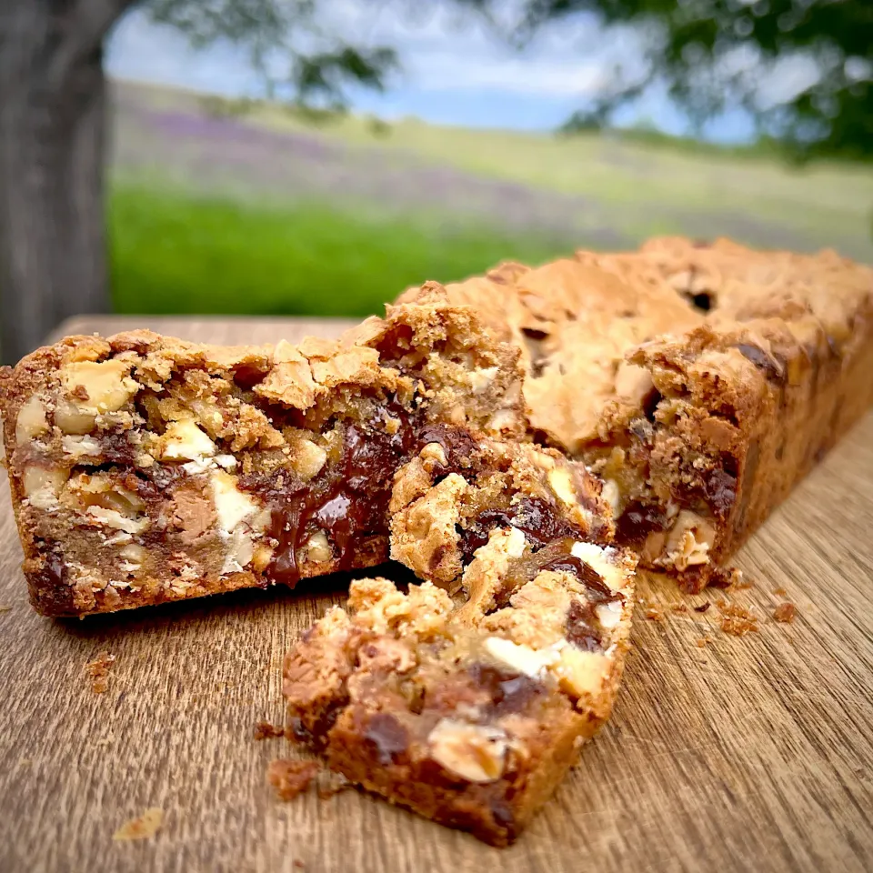 Snapdishの料理写真:Loaded blondie loaf with hazelnuts and three types of chips. Halfway between a cookie and a (slightly molten) candy because I couldn’t wait to cut it.|Dean M Rogersさん