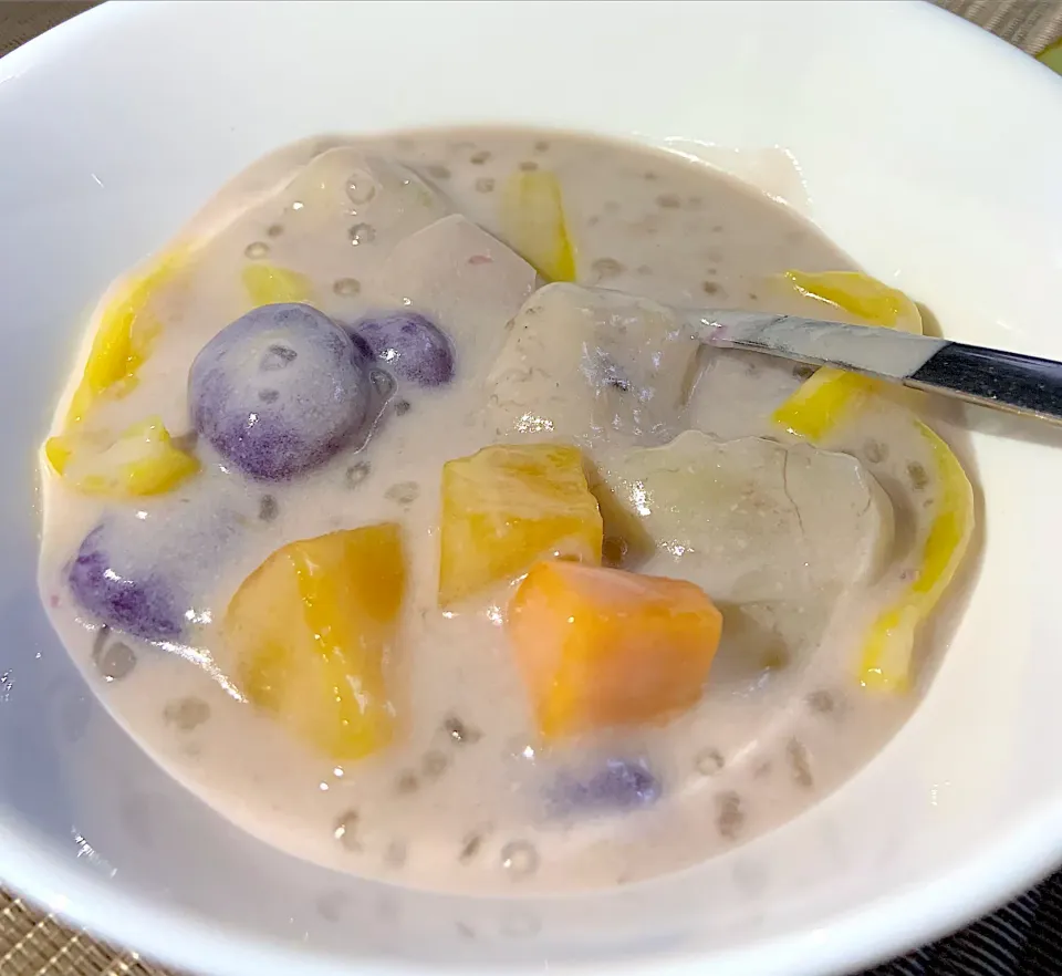 Snapdishの料理写真:We call it Ginatan. Banana plantain, jackfruit, sweet potatoes, yam, glutinous rice ball and tapioca pearl cook in coconut milk, sugar, vaniila or pandan leaves|Ahnneさん