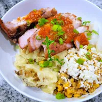 thick cut pork chops smashed potatoes and elote.|justinさん