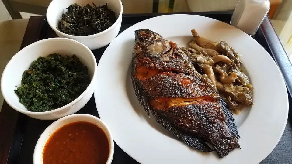 dry fried bream fish served with mushroom,sauce, pumpkin leaves and sweet potato leaves|Busisiwe Malunduさん