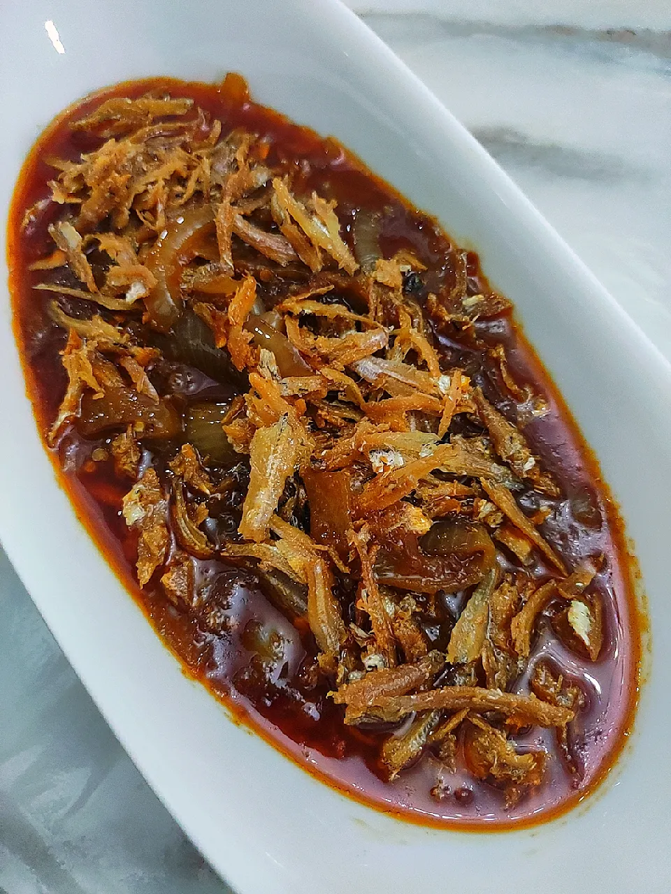 Anchovies with yellow onion in spicy gravy|Jocelyn SETさん