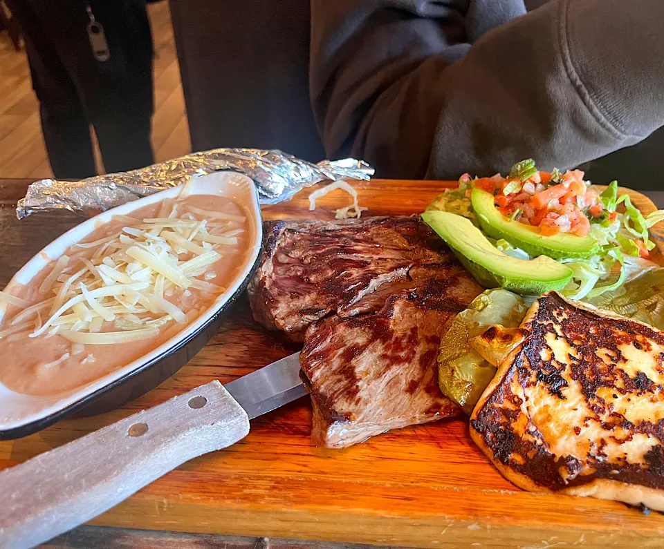 Steak dinner with grilled panela cheese and cactus, avocado salad, and refried beans|🌺IAnneさん