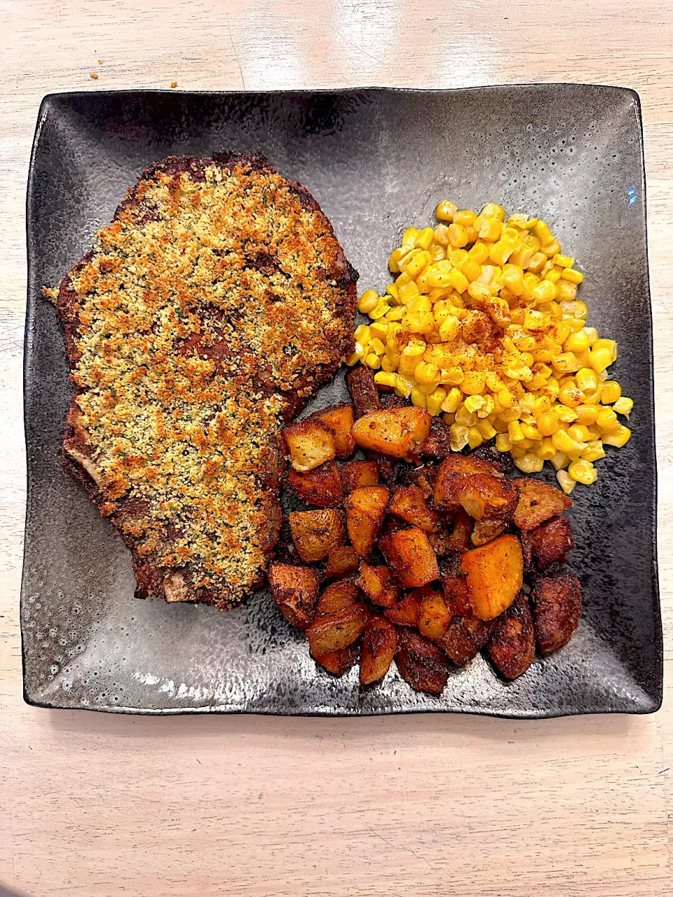 Snapdishの料理写真:Garlic Breadcrumb Crusted Ribeye w/potato and corn|Rafael Pachecoさん