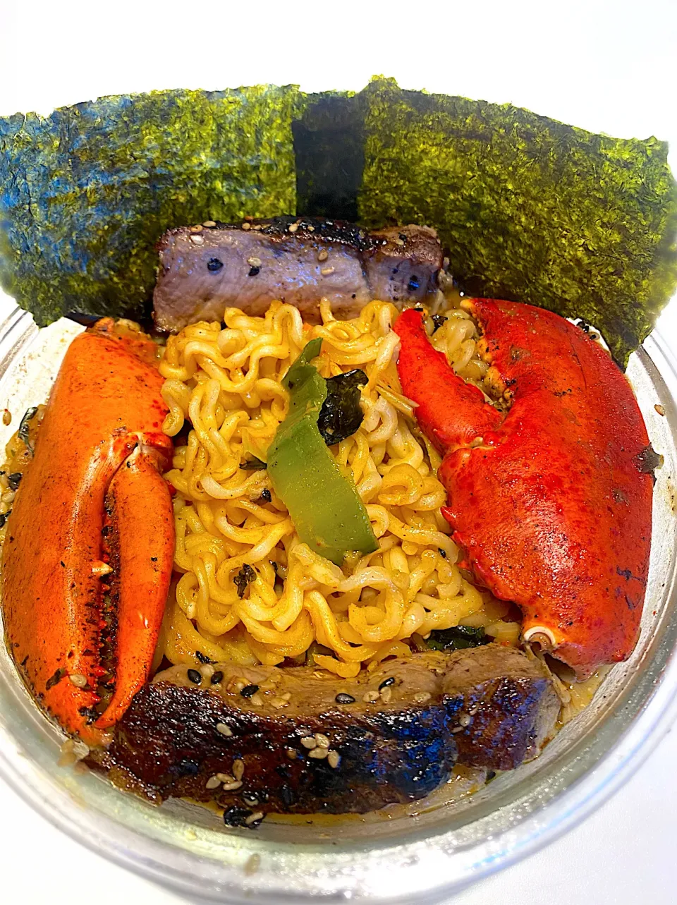 BentoFox's dish A spicy miso ramen with asparagus, leek, Nori seaweed topped with steak & two lobster claws|BentoFoxさん