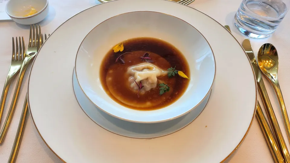 ravioli stuffed with foie gras and confit onions, duck consomme|Ninaさん