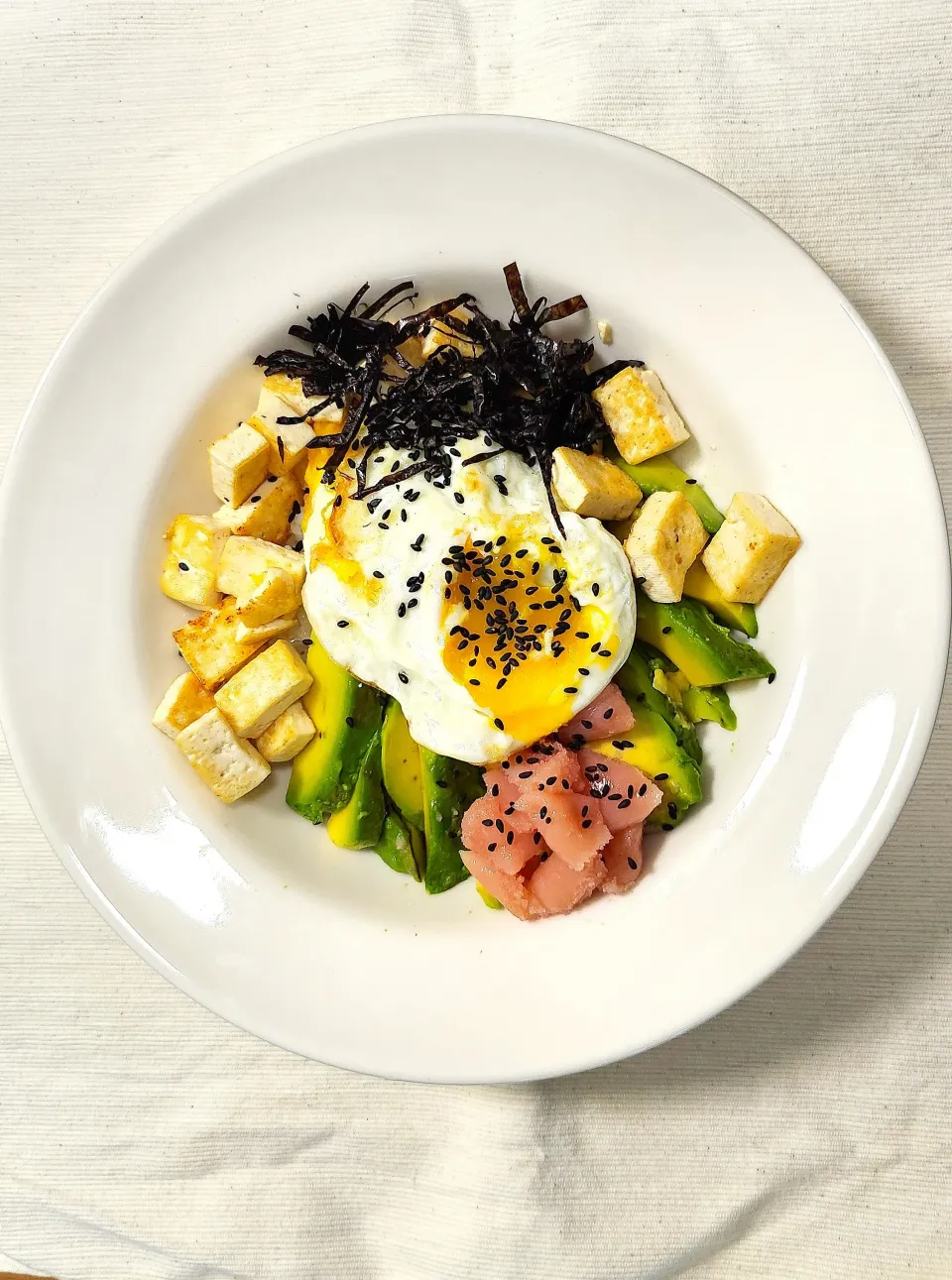 Snapdishの料理写真:Nina's dish a bowl of rice served with avocado, salted pollack roe, tofu and fried egg|Ninaさん