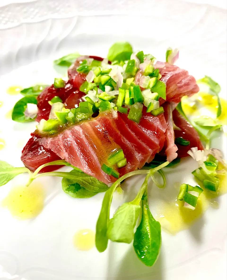 Snapdishの料理写真:Bonito Crudo topped with a light soy sauce and garnished with jalapeno for a brust of flavor|gonbenさん