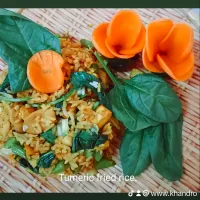 Turmeric fried rice with cucumber and carrots flowers as a salad.| Priyamayaさん