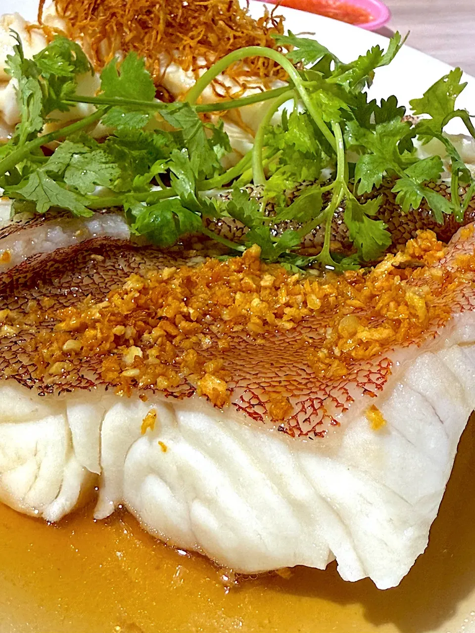 Steamed fish with fried ginger and garlic.|B&Bさん