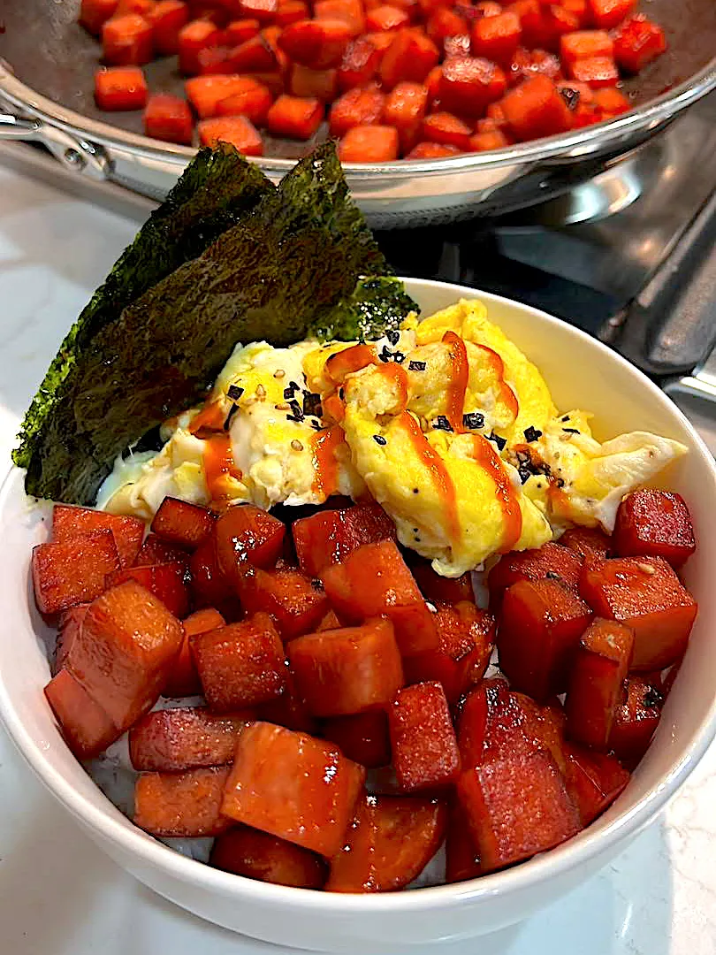 BentoFox's dish A bed of rice topped with fried Spam, an omelette, two sheets of Nori, and hot sauce 😋|BentoFoxさん