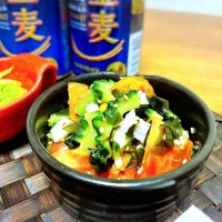 畑のゴーヤとトマト＆スーパーの長芋＆ワカメのスイチリみそ胡麻和え。|tonaさん